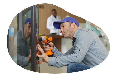 A vending machine operator working on a machine.