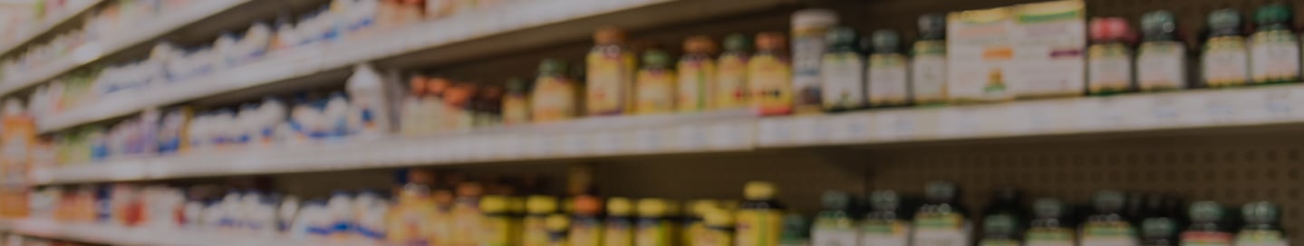 Shelves filled with vitamin bottles in a vitamin and dietary supplement store. Shelves filled with vitamin bottles in a vitamin and dietary supplement store.