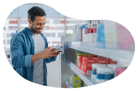 A shopper examines a product in a vitamin store. A shopper examines a product in a vitamin store.