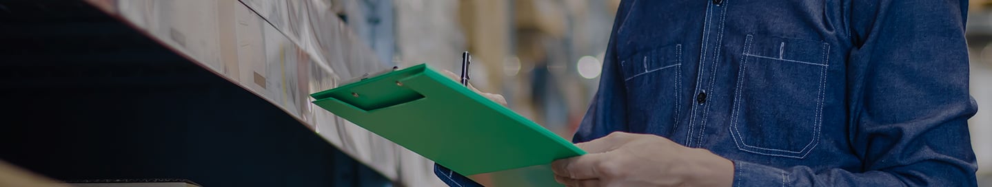A Walmart seller checks off inventory on a clipboard. A Walmart seller checks off inventory on a clipboard.