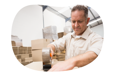 A Walmart seller tapes up a box about to be shipped to a customer.