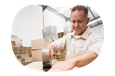 A Walmart seller tapes up a box about to be shipped to a customer.