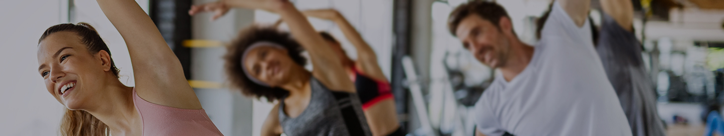 An aerobics instructor teaches a class at their studio.