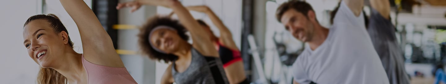 An aerobics instructor teaches a class at their studio. An aerobics instructor teaches a class at their studio.