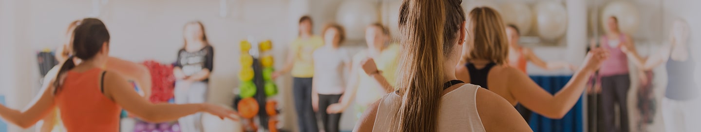 Students practice their moves at a dance studio.