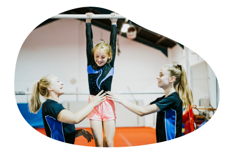 Students and their teacher at a gymnastics club. Students and their teacher at a gymnastics club.
