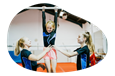 Students and their teacher at a gymnastics club.