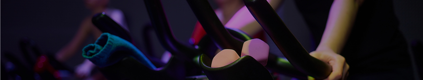 Close-up of an indoor cycling bike at a spin class. Close-up of an indoor cycling bike at a spin class.