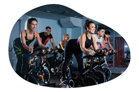A group of participants in a spin cycling class. A group of participants in a spin cycling class.