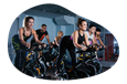 A group of participants in a spin cycling class.