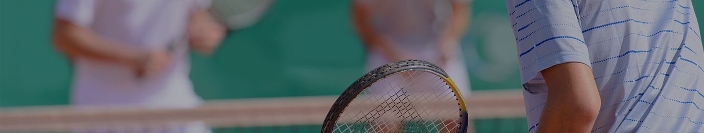 Members of a tennis club playing a match.