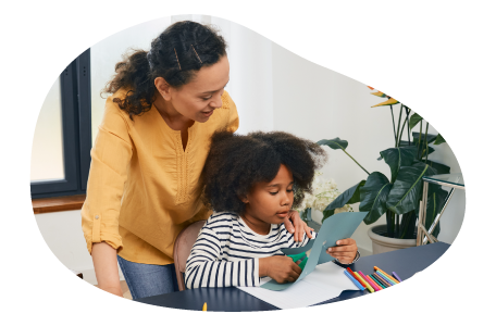 Therapist guiding a child to express their feelings through art.