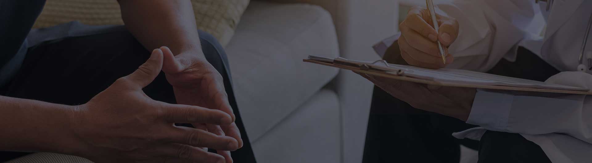 Doctor consulting male patient, working on diagnostic examination on men's health disease or mental illness.