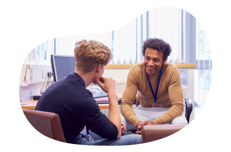 School counselor speaking with a student in their office. School counselor speaking with a student in their office.