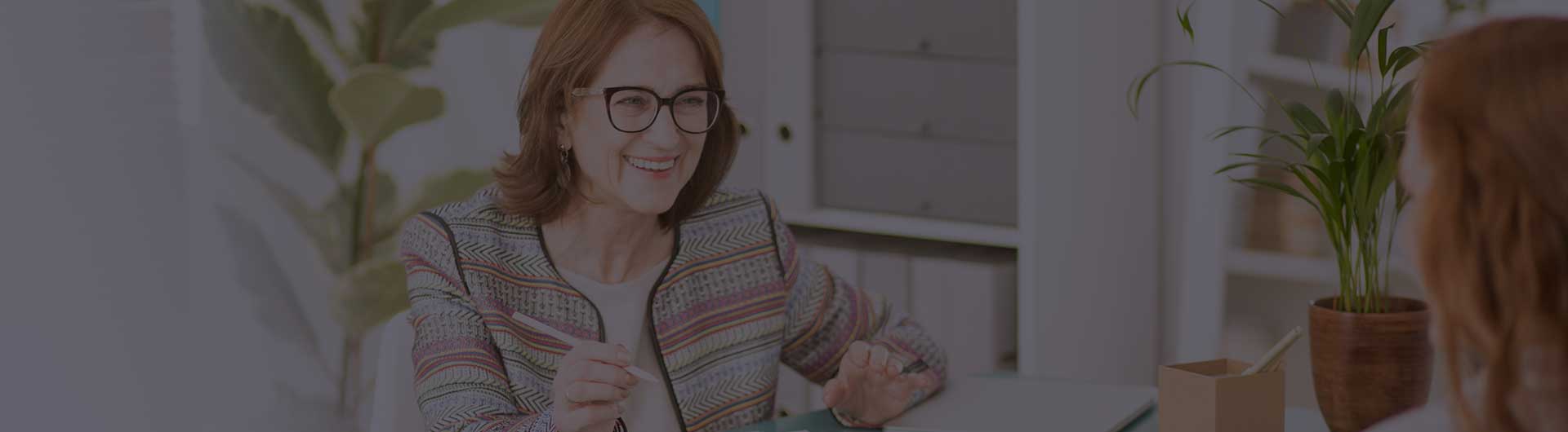 Wellness advisor talking to her female patient during therapy.