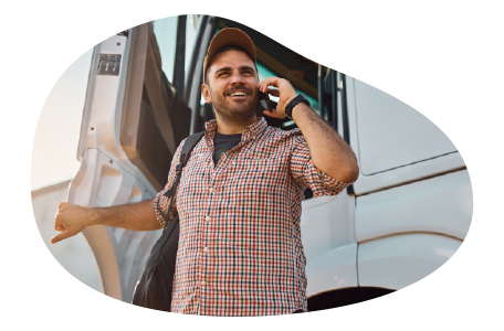 The owner of a motor carrier company talking on the phone with a client.