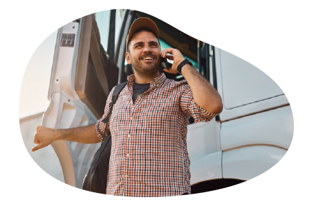 The owner of a motor carrier company talking on the phone with a client. The owner of a motor carrier company talking on the phone with a client.
