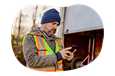 The driver of a utility trailer texting a client.