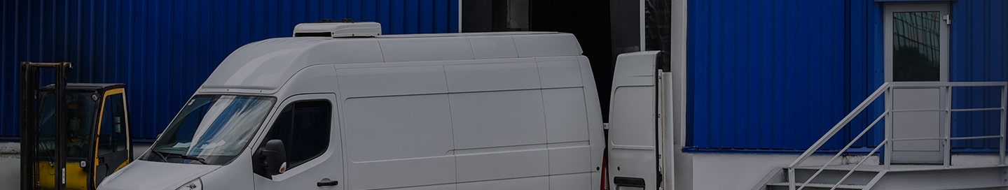 A commercial van at a loading dock.