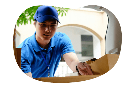 An Amazon relay driver loading packages into a truck.