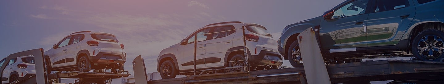 New cars being transported by a car hauler. New cars being transported by a car hauler.