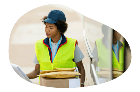 A courier driver sorts through packages. A courier driver sorts through packages.