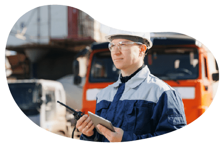 A dump truck business manager directing dump trucks on site. A dump truck business manager directing dump trucks on site.