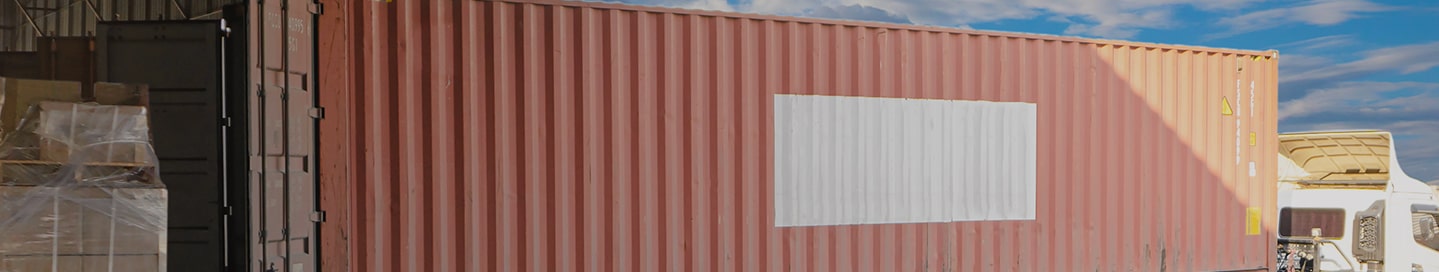 Truck parked at loading dock.