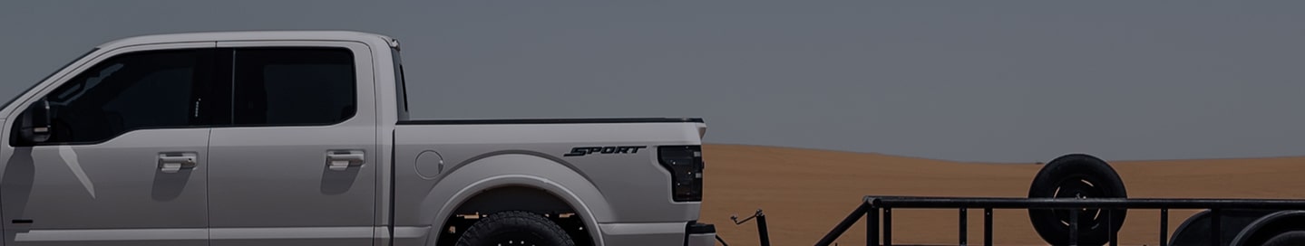 A hotshot driver's pickup and trailer.