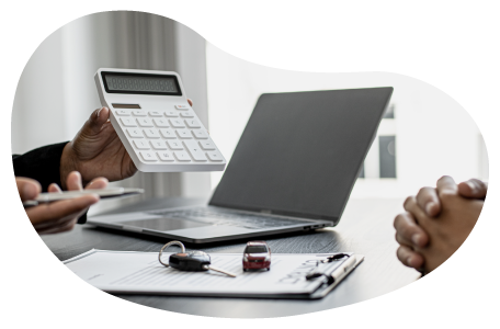 Trucking business owners calculating the cost of insurance. Trucking business owners calculating the cost of insurance.
