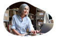 Jewelry wholesaler employee checking inventory on a laptop.