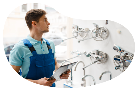 Wholesaler employee checking inventory of plumbing parts at a facility.