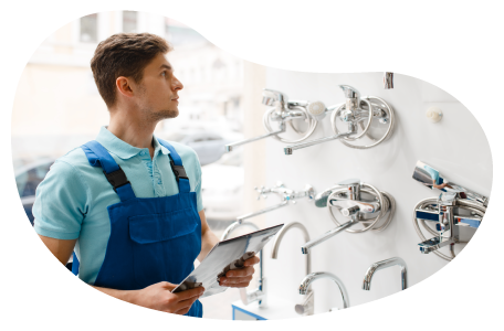 Wholesaler employee checking inventory of plumbing parts at a facility. Wholesaler employee checking inventory of plumbing parts at a facility.
