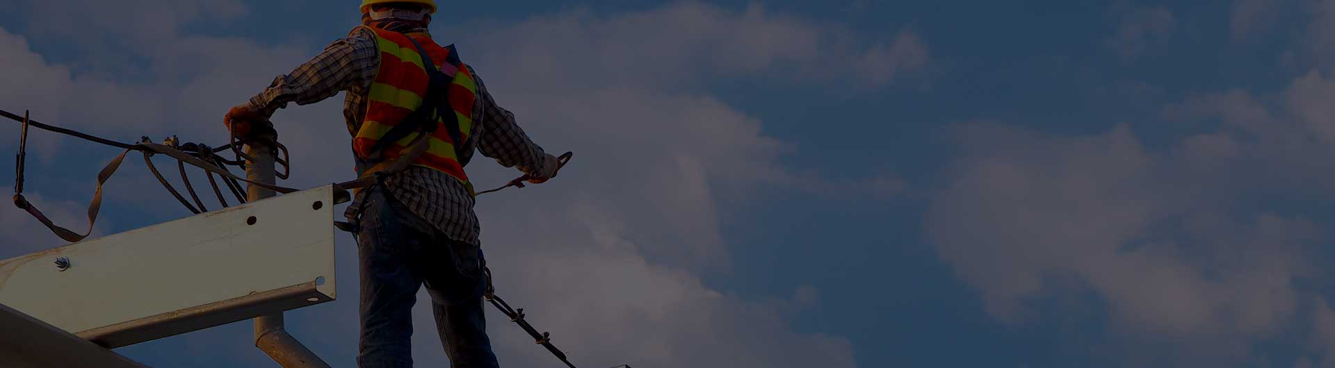 Construction professional working on a high rise.