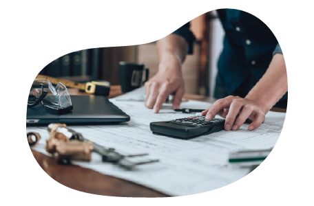 A small business owner calculating their builder's risk insurance costs A small business owner calculating their builder's risk insurance costs