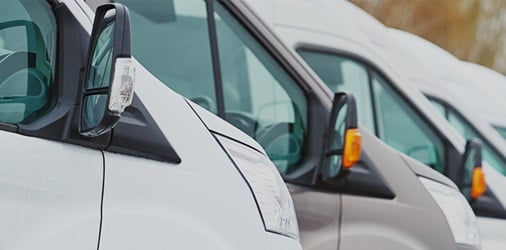 Commercial delivery vans in row.