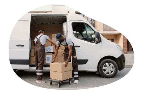 A small business owner and their employee loading the company van with deliveries A small business owner and their employee loading the company van with deliveries