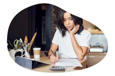 A small business owner calculating their commercial property insurance costs