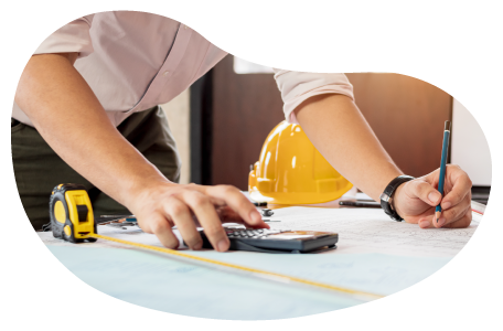 A contractor calculating measurements for a construction assignment A contractor calculating measurements for a construction assignment