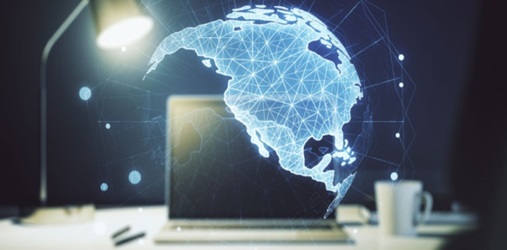 Map of North America suspended over a laptop.