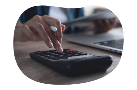 A small business owner calculating their cyber liability costs A small business owner calculating their cyber liability costs