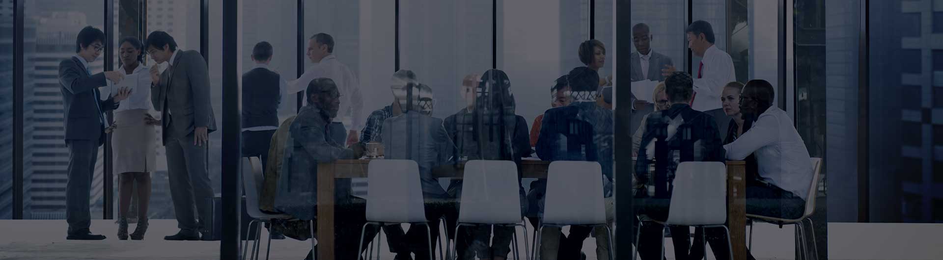 Board members in a conference meeting room. Board members in a conference meeting room.