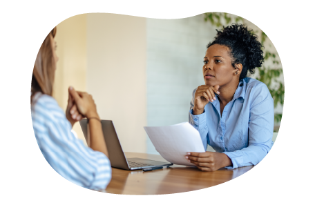 A small business owner discussing their EPLI policy with a lawyer