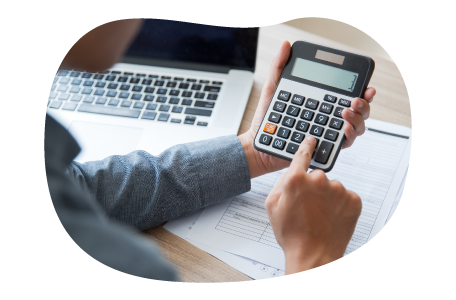 A small business owner calculating their errors and omissions costs A small business owner calculating their errors and omissions costs