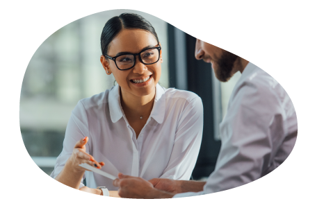 Two small business owners reviewing insurance information.