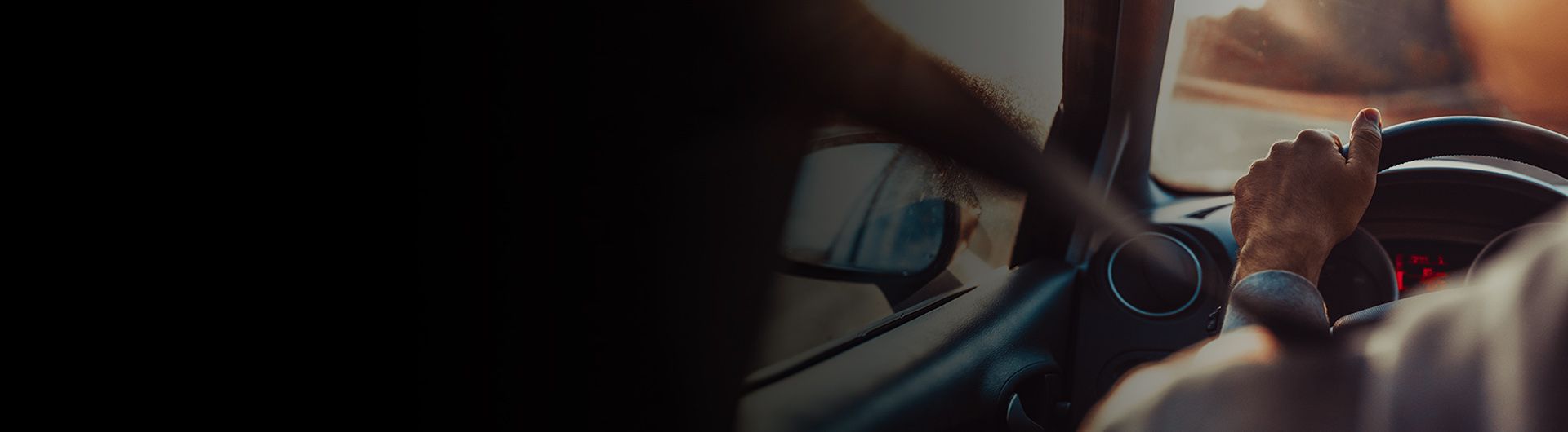 Person behind the wheel of a vehicle.