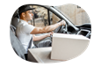 A small business owner delivering a customer's order in their personal vehicle