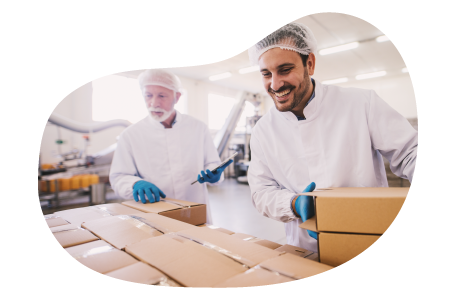 A small business owner and their employee packing up customer orders at their storage unit 