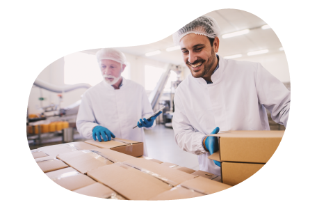 A small business owner and their employee packing up customer orders at their storage unit  A small business owner and their employee packing up customer orders at their storage unit