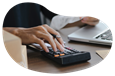 A small business owner calculating their inland marine insurance costs